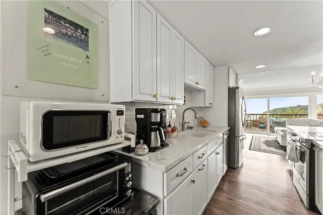 a kitchen with a stove and a microwave