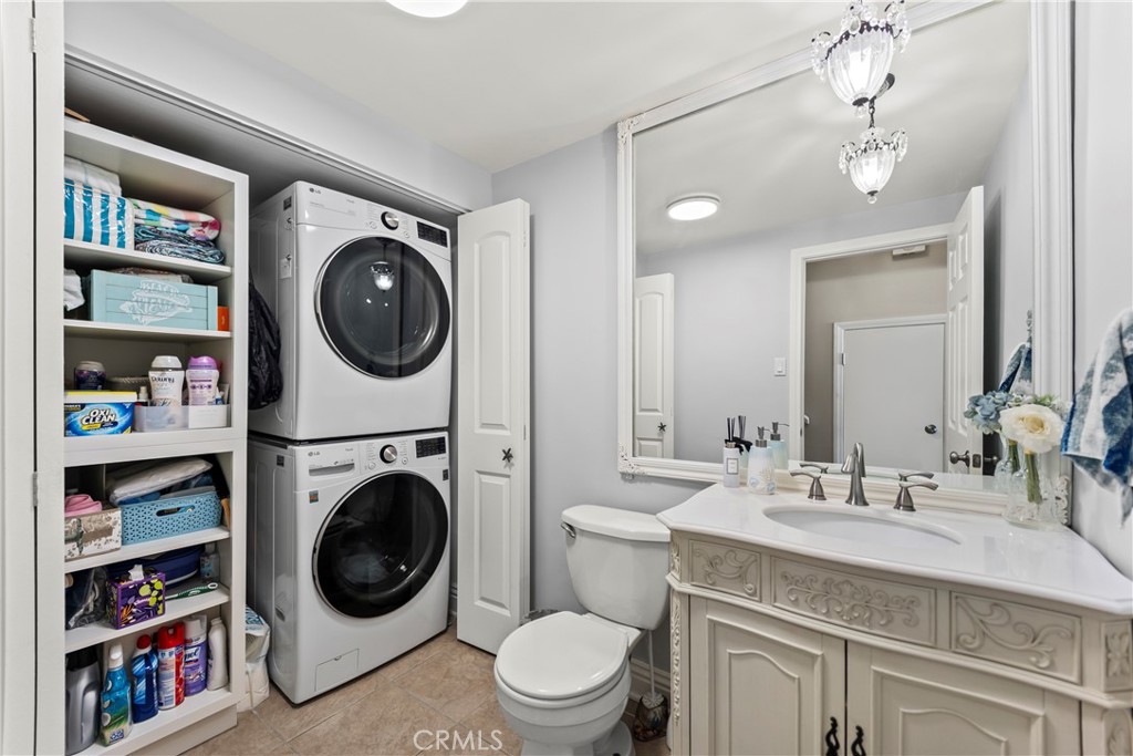 23920 De Ville Way, Unit D Malibu, CA 90265 - Photo 16 of 42 a spacious bathroom with a washing machine and a sink
