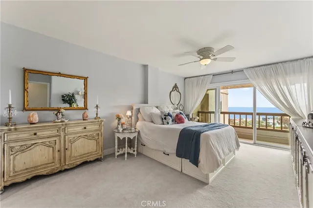 a bed room with two beds and a large window