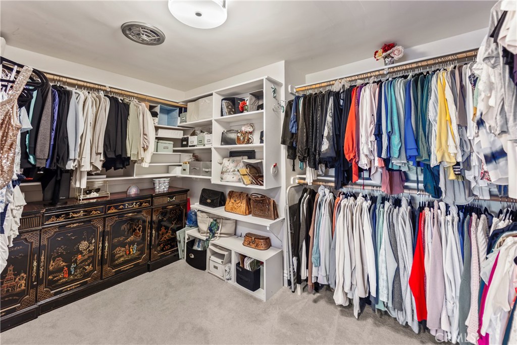 23920 De Ville Way, Unit D Malibu, CA 90265 - Photo 26 of 42 a view of walk in closet with clothes and shoes