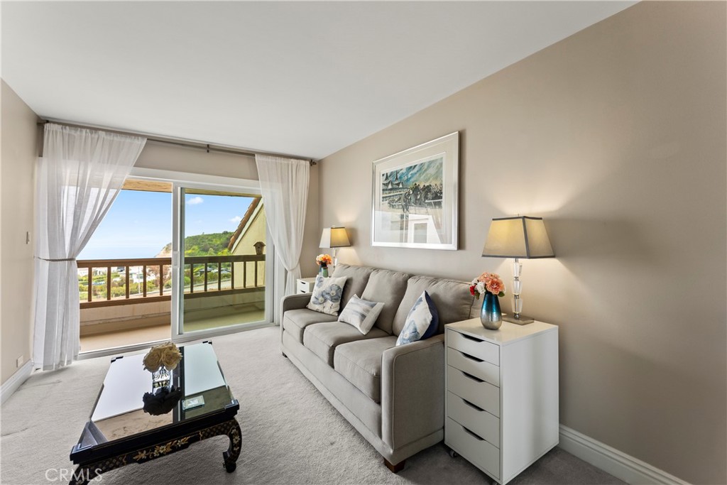 23920 De Ville Way, Unit D Malibu, CA 90265 - Photo 30 of 42 a living room with furniture and a window