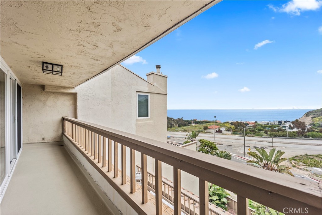 23920 De Ville Way, Unit D Malibu, CA 90265 - Photo 35 of 42 a view of city and mountain from a balcony