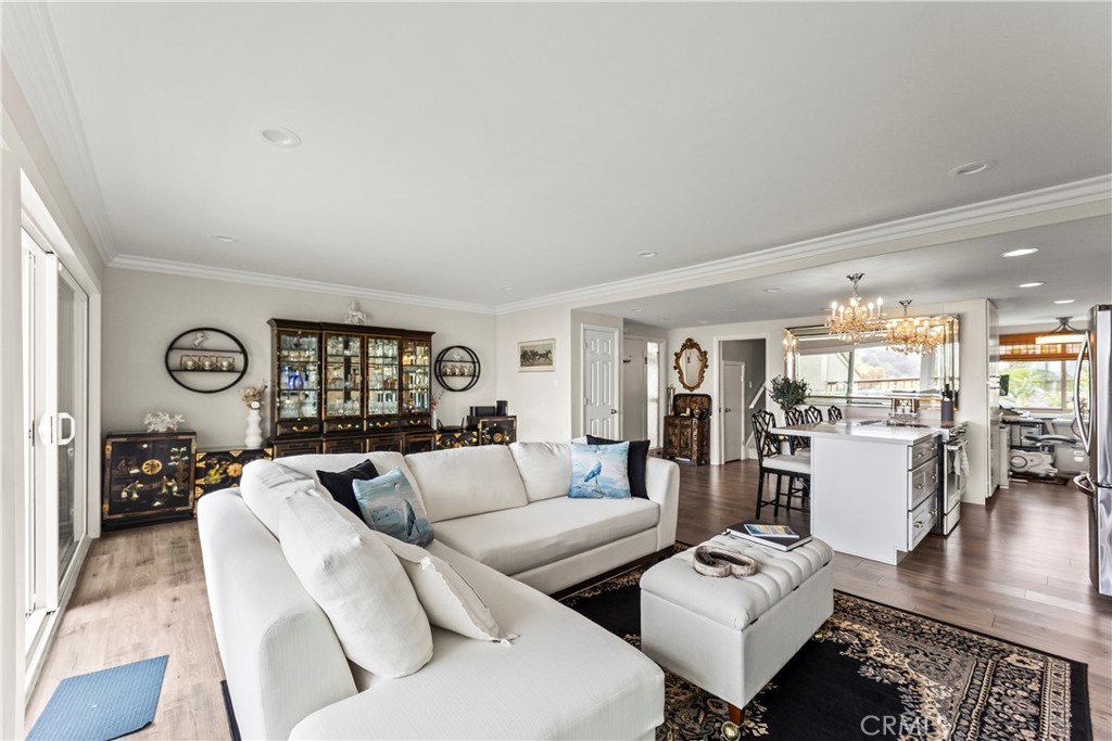 23920 De Ville Way, Unit D Malibu, CA 90265 - Photo 4 of 42 a living room with furniture and wooden floor