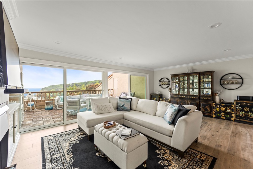 23920 De Ville Way, Unit D Malibu, CA 90265 - Photo 9 of 42 a living room with furniture and a large window