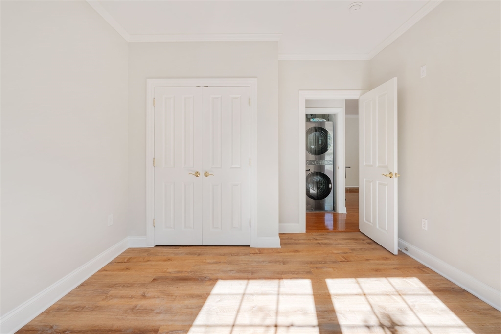 248 Albion Street, Unit 321 Wakefield, MA 01880 - Photo 14 of 19 a view of entryway with wooden floor