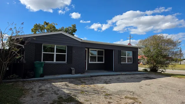 a brick house with a large windows