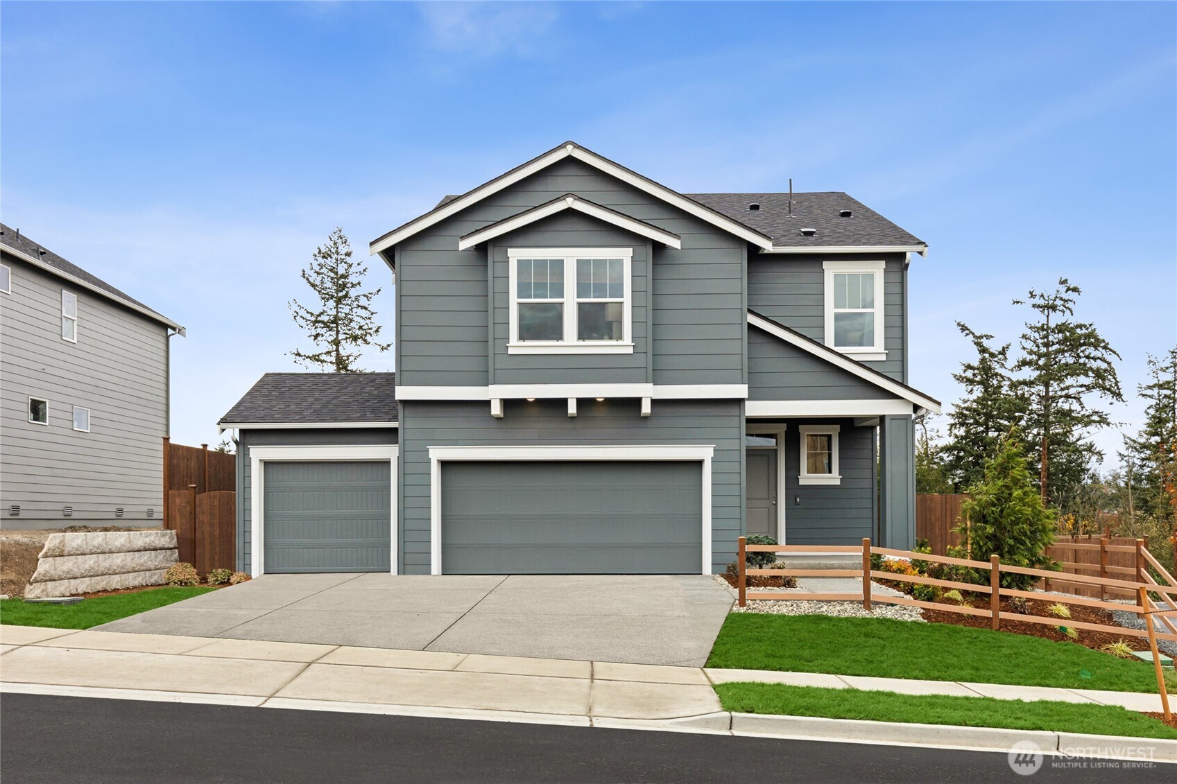 536 Wall Street, Unit 33 Buckley, WA 98321 - Photo 1 of 40 a front view of a house with a yard and garage