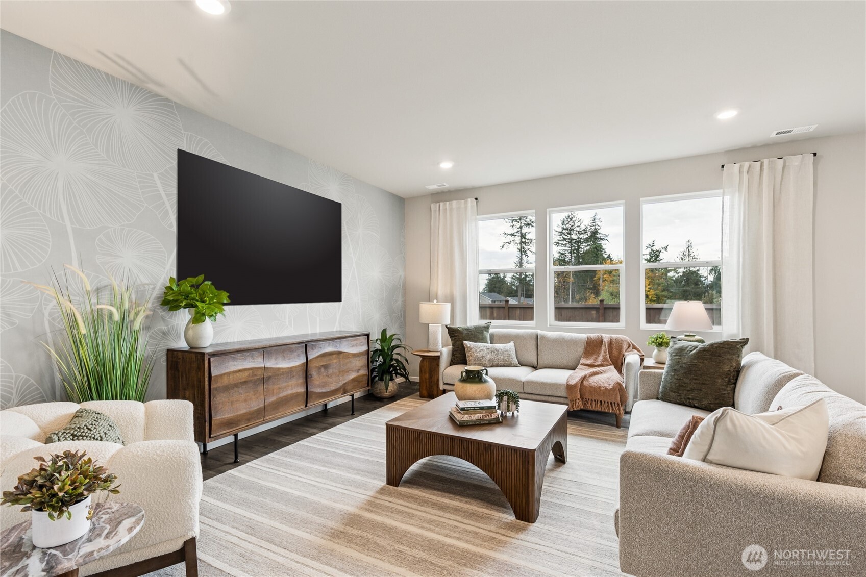 536 Wall Street, Unit 33 Buckley, WA 98321 - Photo 6 of 40 a living room with furniture and a flat screen tv