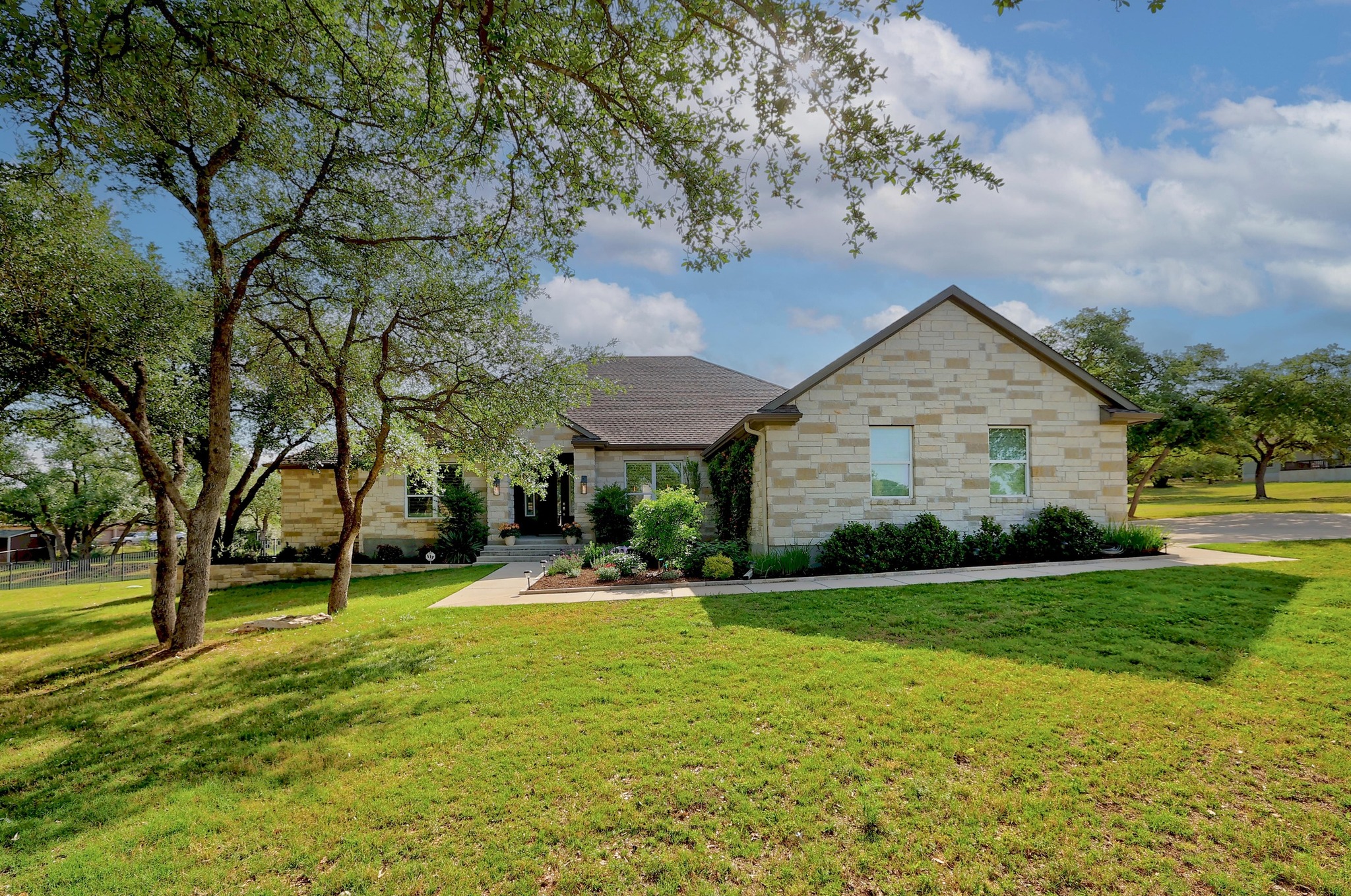 105 Graystone Lane Georgetown, TX 78633 - Photo 2 of 32 View of front of property with a front lawn and stone siding