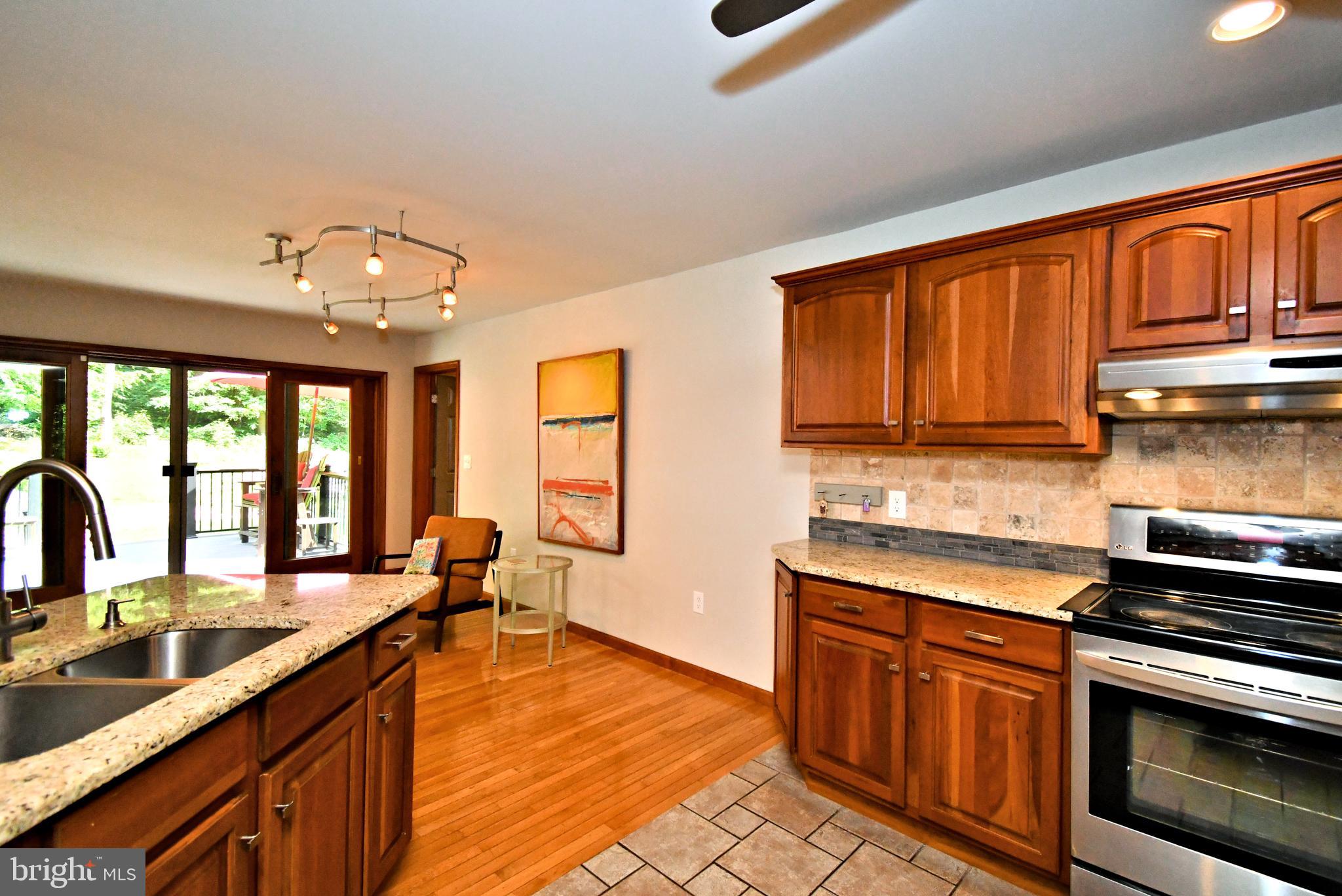 2415 Schaffer Road Pottstown, PA 19464 - Photo 22 of 93 a kitchen with stainless steel appliances granite countertop a sink stove and cabinets