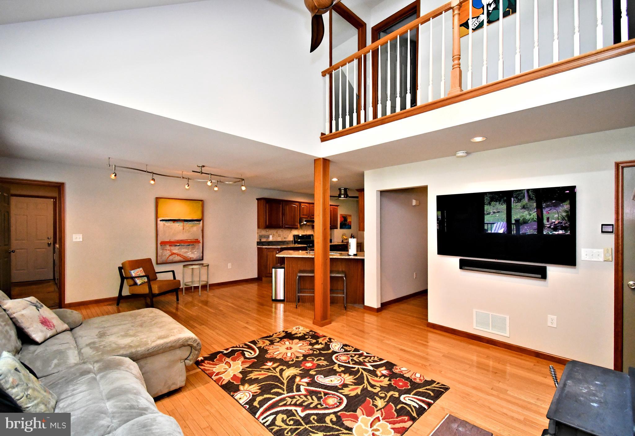 2415 Schaffer Road Pottstown, PA 19464 - Photo 27 of 93 a living room with furniture and a flat screen tv