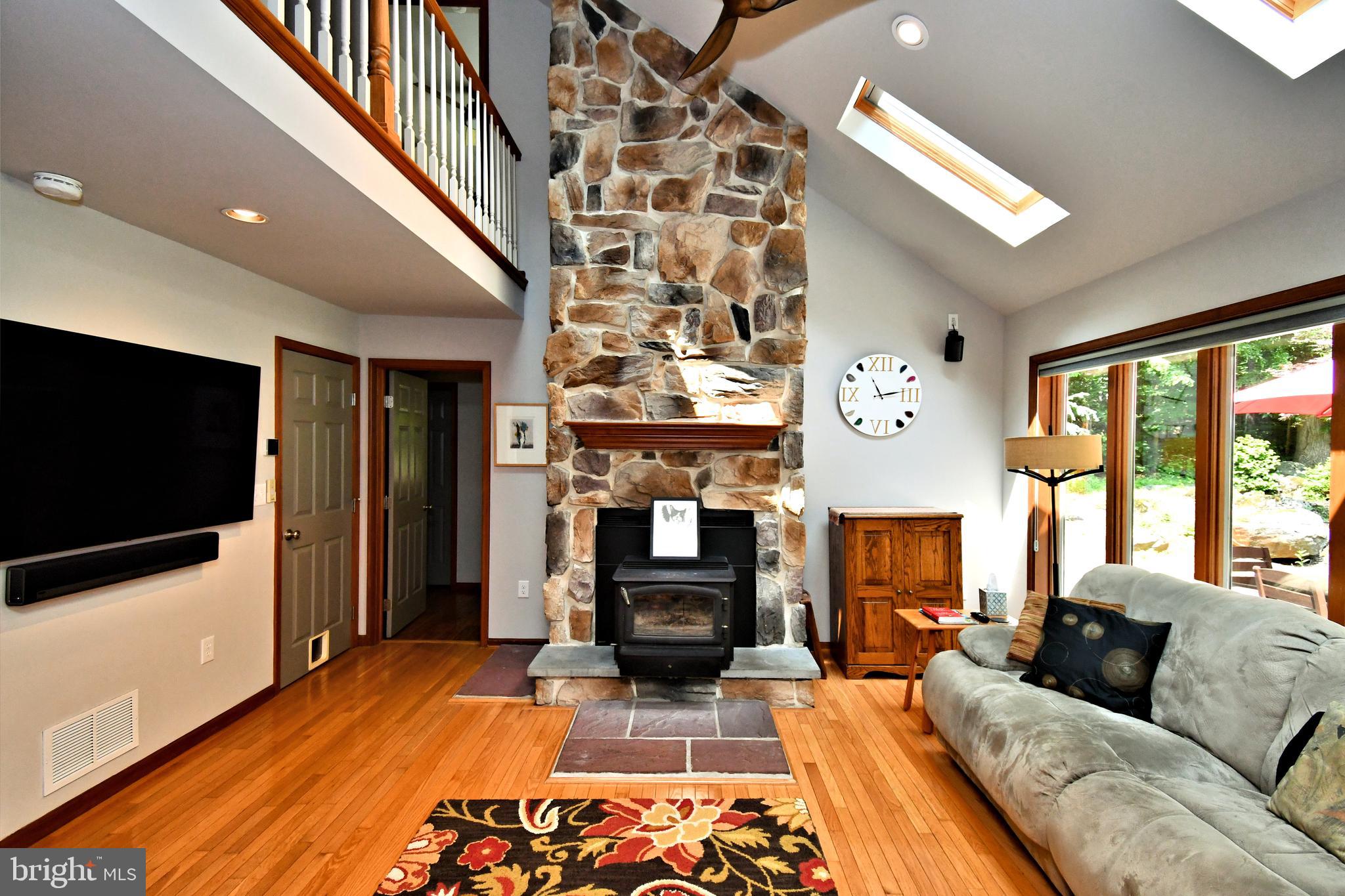 2415 Schaffer Road Pottstown, PA 19464 - Photo 30 of 93 a living room with fireplace furniture and a flat screen tv
