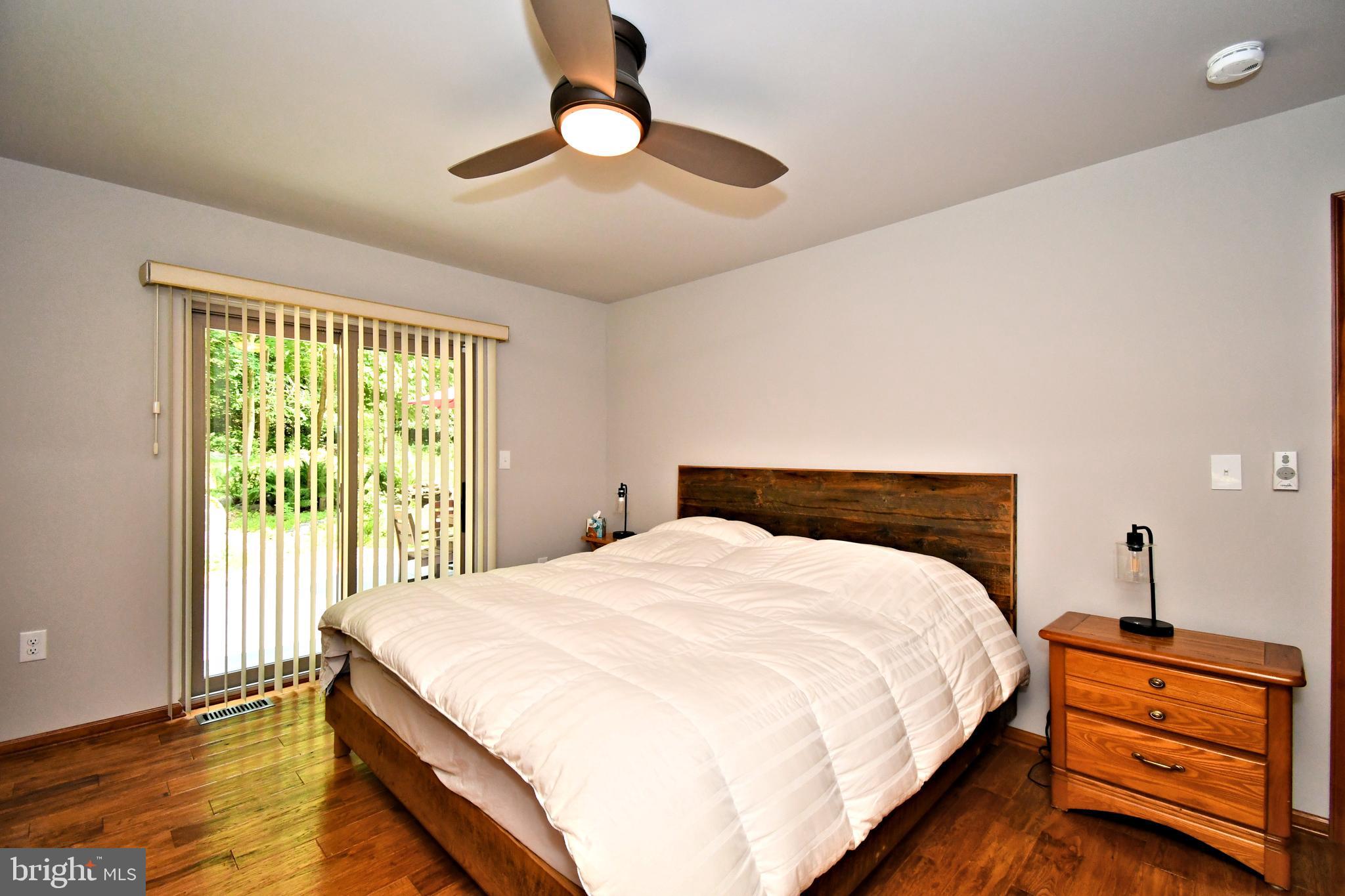 2415 Schaffer Road Pottstown, PA 19464 - Photo 32 of 93 a bedroom with a bed and a chandelier