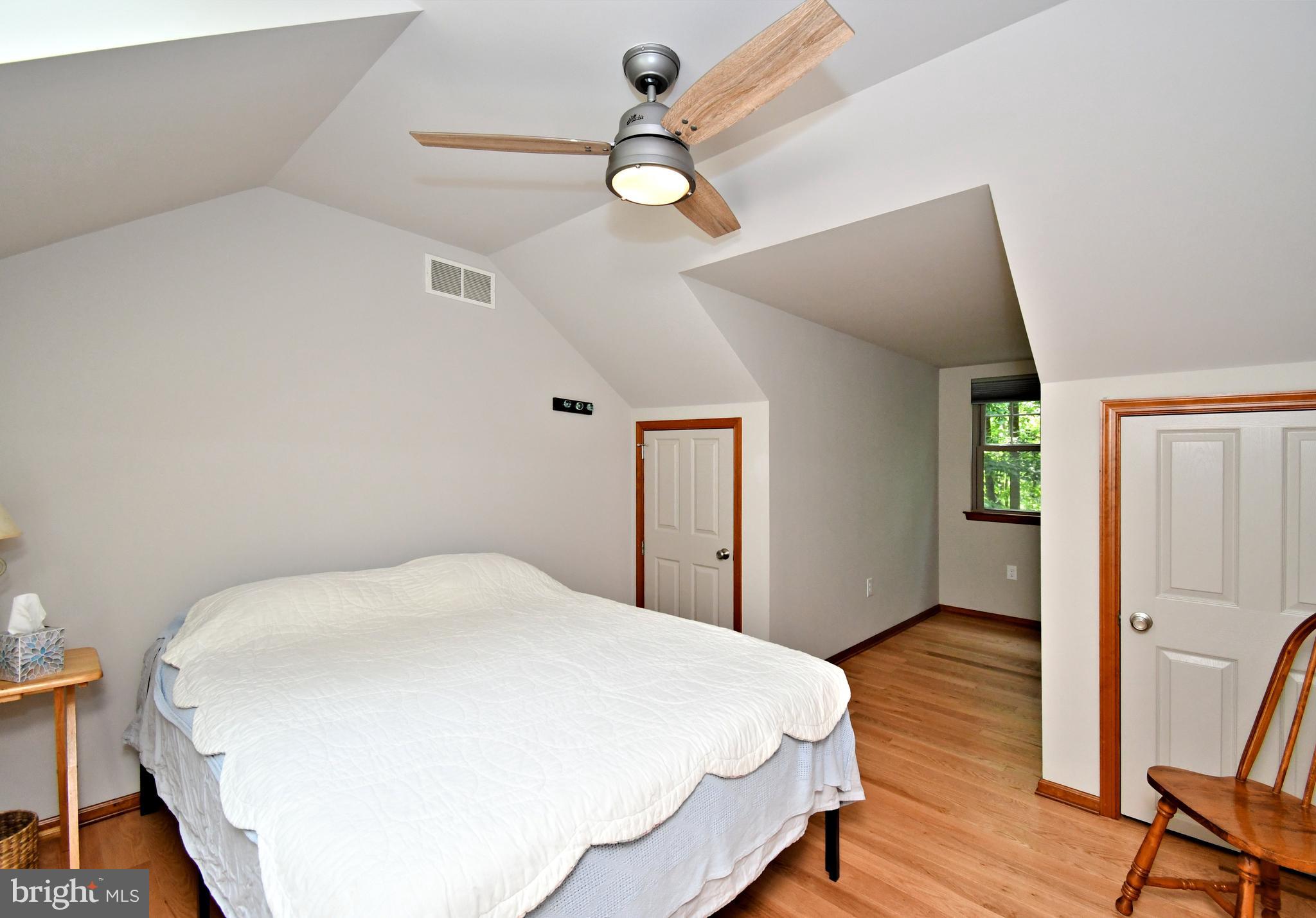 2415 Schaffer Road Pottstown, PA 19464 - Photo 47 of 93 a bedroom with a bed and a chandelier