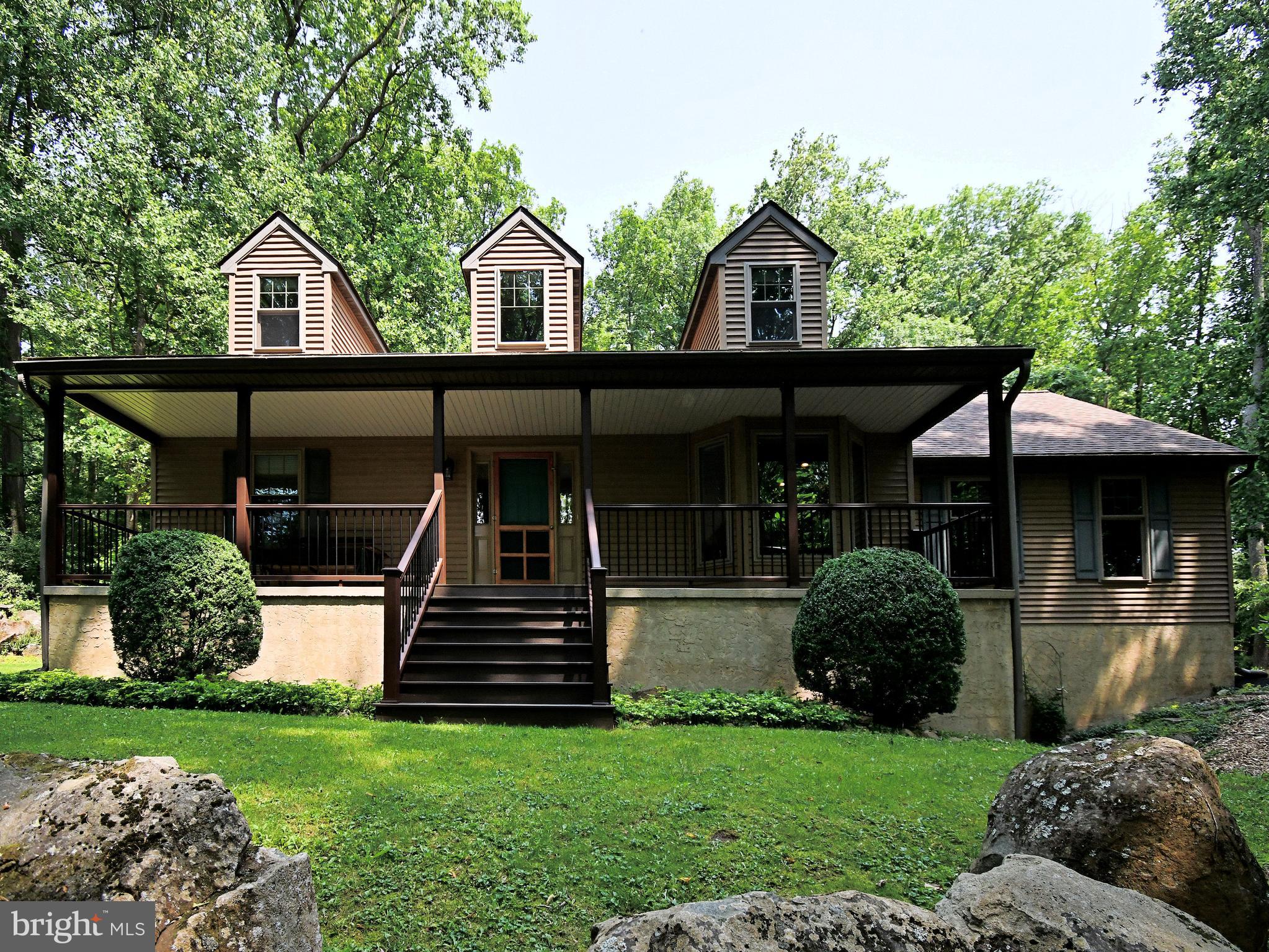 2415 Schaffer Road Pottstown, PA 19464 - Photo 5 of 93 a front view of a house with garden