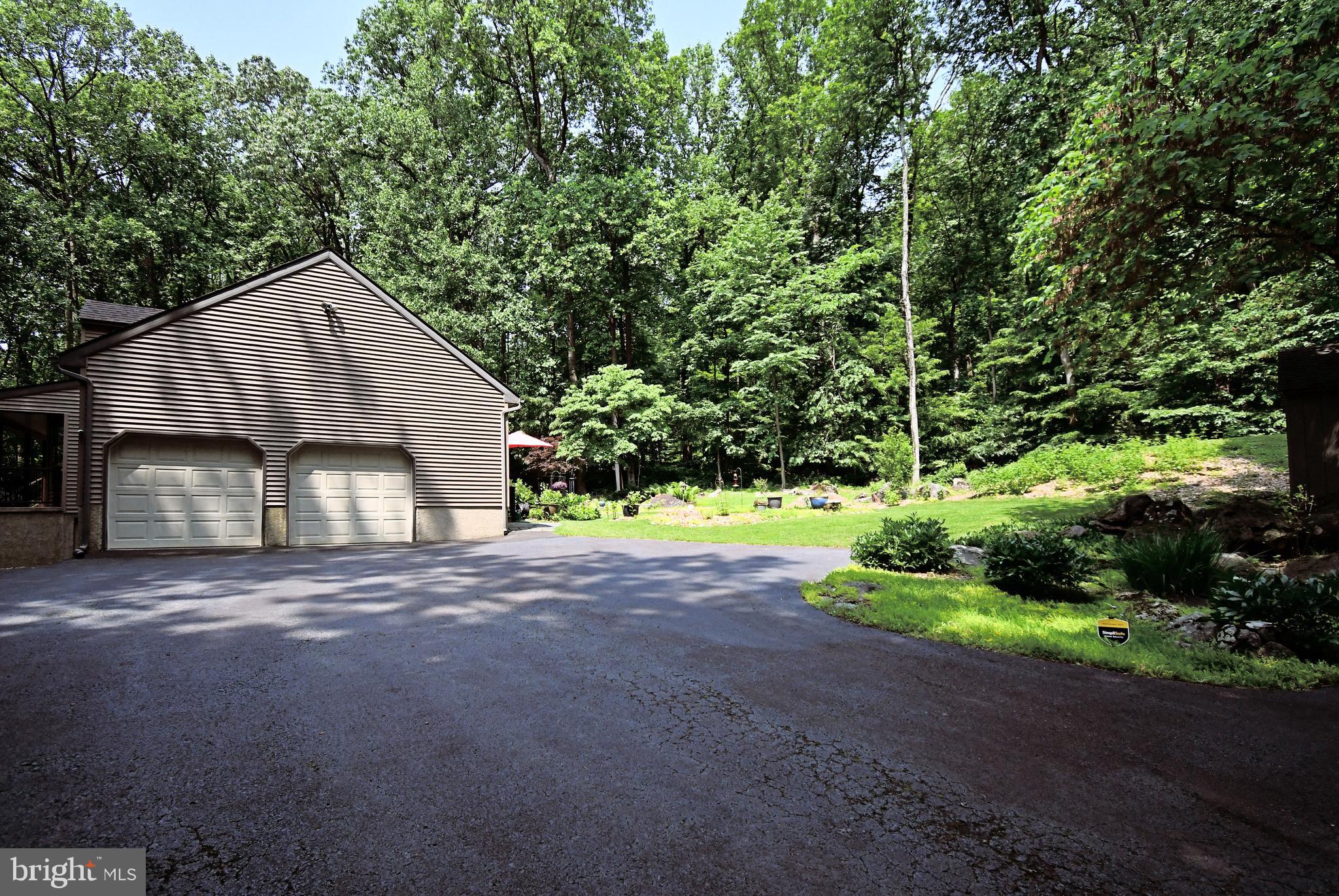 2415 Schaffer Road Pottstown, PA 19464 - Photo 64 of 93 a front view of a house with yard and green space
