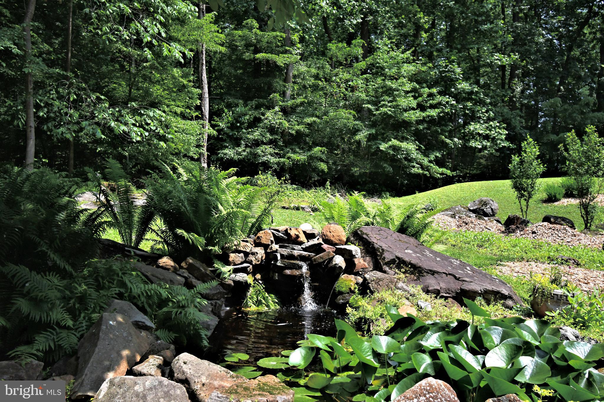 2415 Schaffer Road Pottstown, PA 19464 - Photo 80 of 93 a view of a garden with a tree