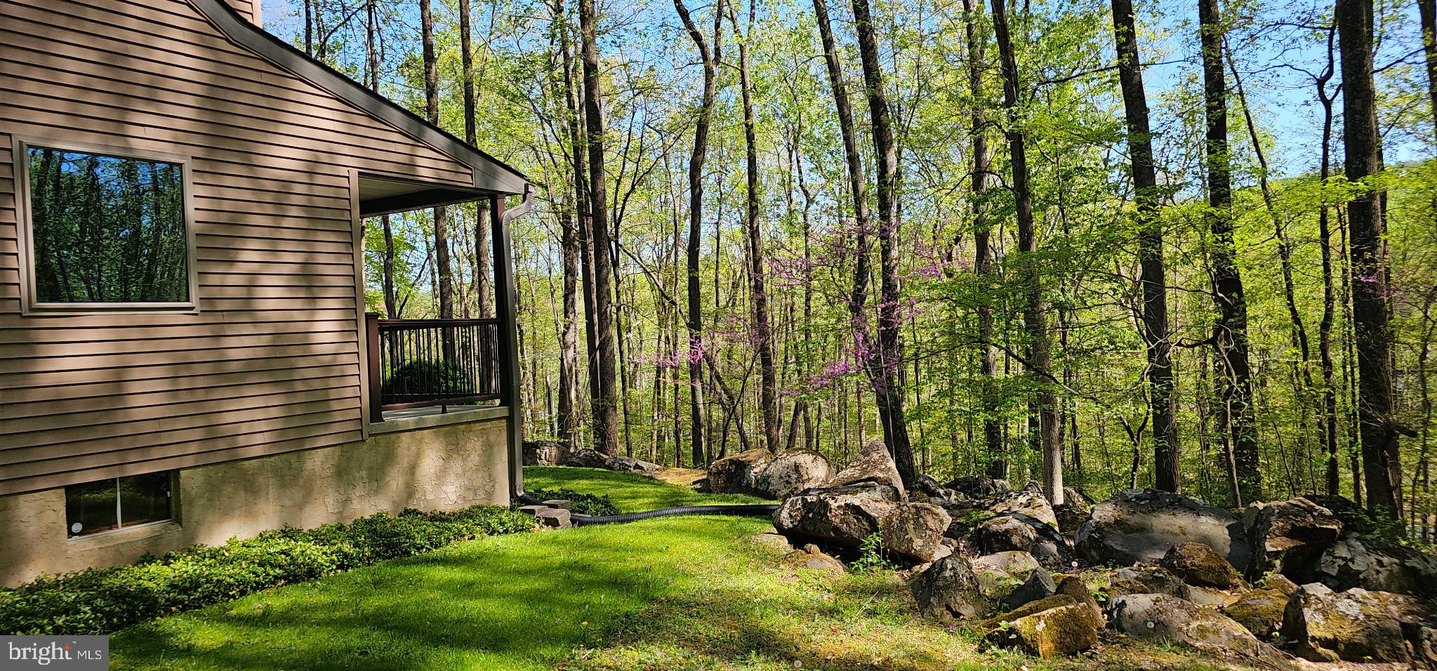 2415 Schaffer Road Pottstown, PA 19464 - Photo 93 of 93 a view of backyard with potted plants and a bench