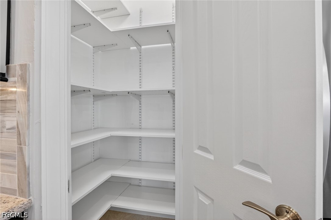 12804 Epping Way Fort Myers, FL 33913 - Photo 13 of 40 a view of walk in closet with empty racks