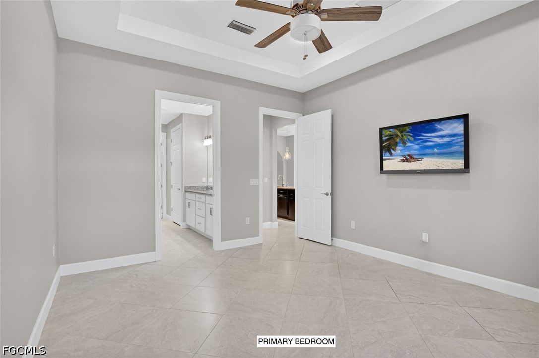 12804 Epping Way Fort Myers, FL 33913 - Photo 18 of 40 an empty room with fan and a ceiling fan
