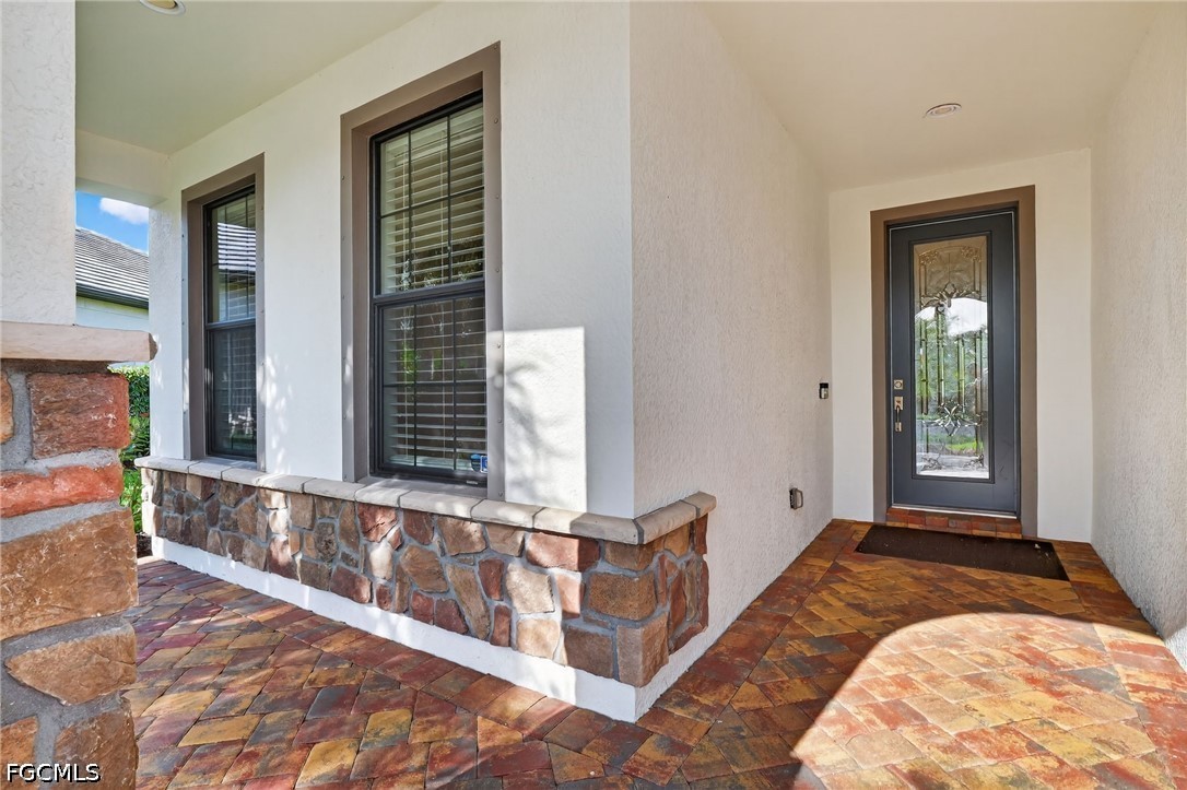12804 Epping Way Fort Myers, FL 33913 - Photo 2 of 40 a spacious bathroom with windows and bathtub
