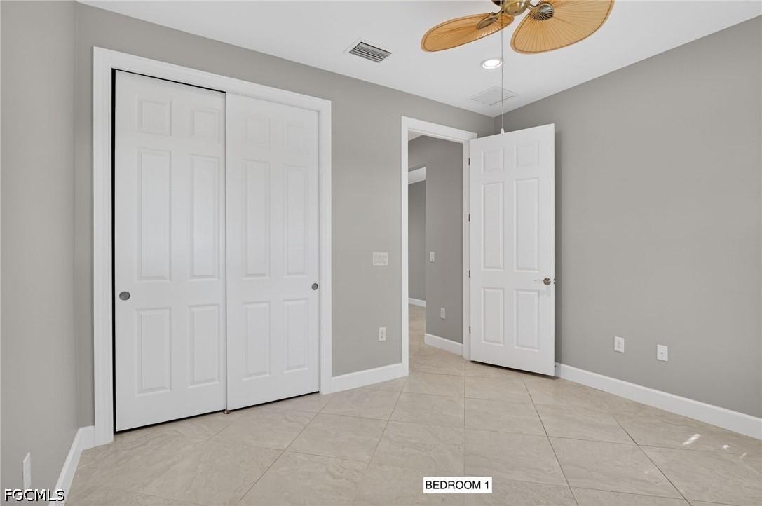 12804 Epping Way Fort Myers, FL 33913 - Photo 23 of 40 an empty room with closet and mirror