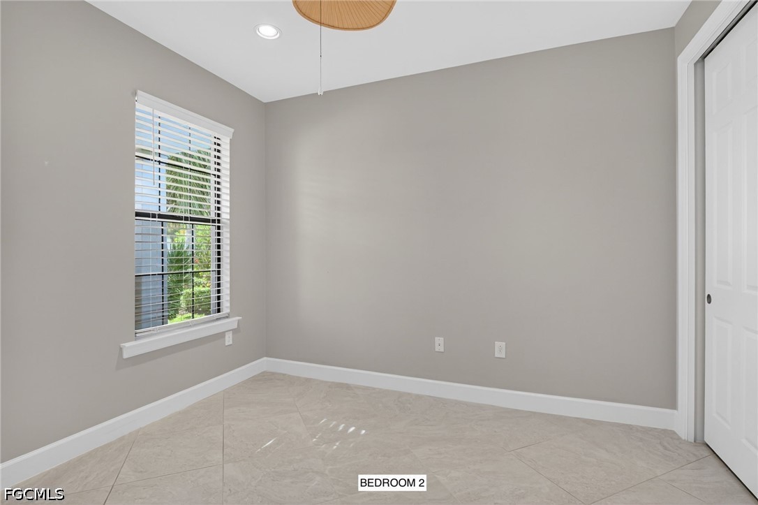 12804 Epping Way Fort Myers, FL 33913 - Photo 24 of 40 a view of an empty room with a window