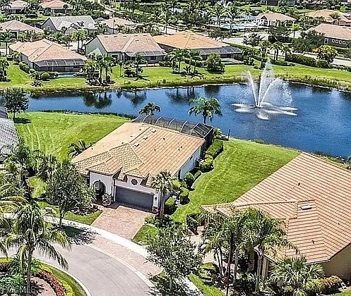 12804 Epping Way Fort Myers, FL 33913 - Photo 36 of 40 an aerial view of a house with a garden and lake view