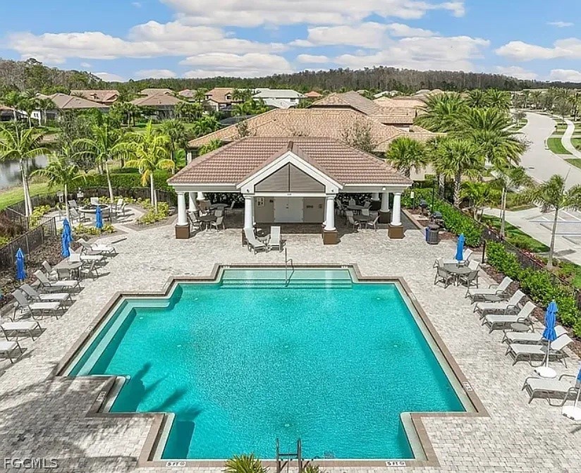 12804 Epping Way Fort Myers, FL 33913 - Photo 39 of 40 a view of a house with pool and a yard