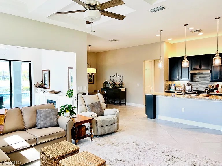 12804 Epping Way Fort Myers, FL 33913 - Photo 4 of 15 a living room with furniture and a flat screen tv