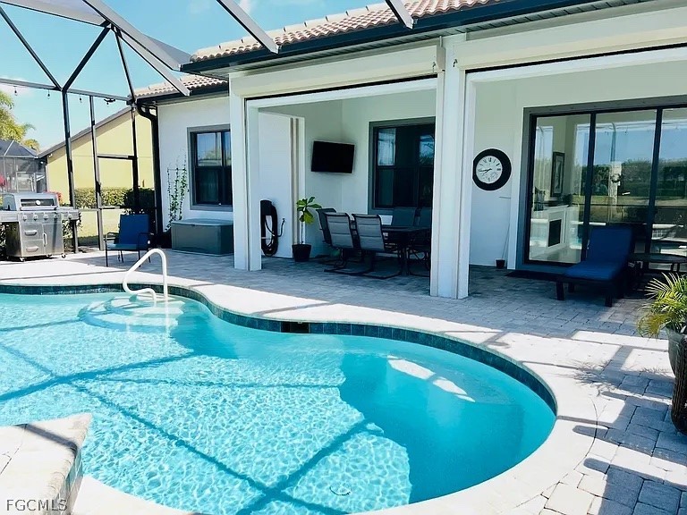 12804 Epping Way Fort Myers, FL 33913 - Photo 10 of 15 a swimming pool with outdoor seating and yard
