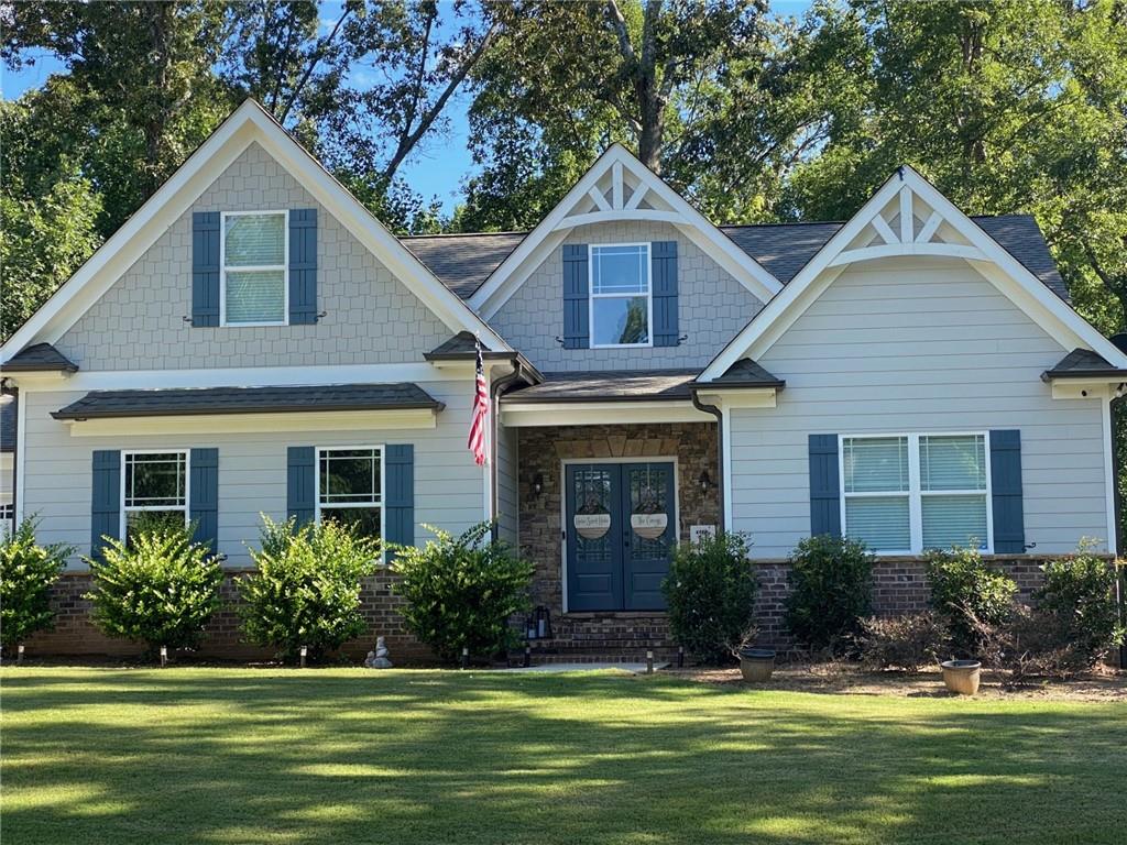 a front view of a house with a yard