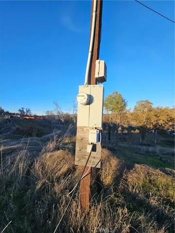 a view of a yard with iron fence