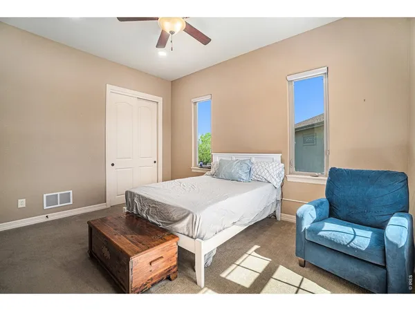 a living room with a bed furniture and a window