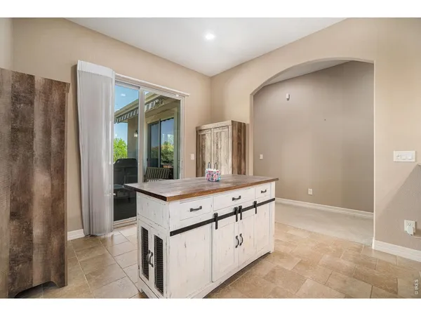 a kitchen with granite countertop a stove and a sink