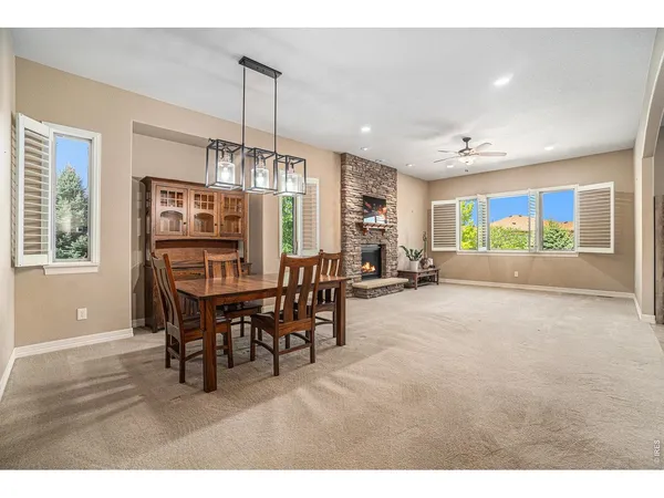 a dining room with furniture and window