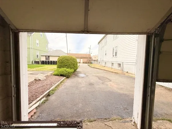a view of a back yard from a porch