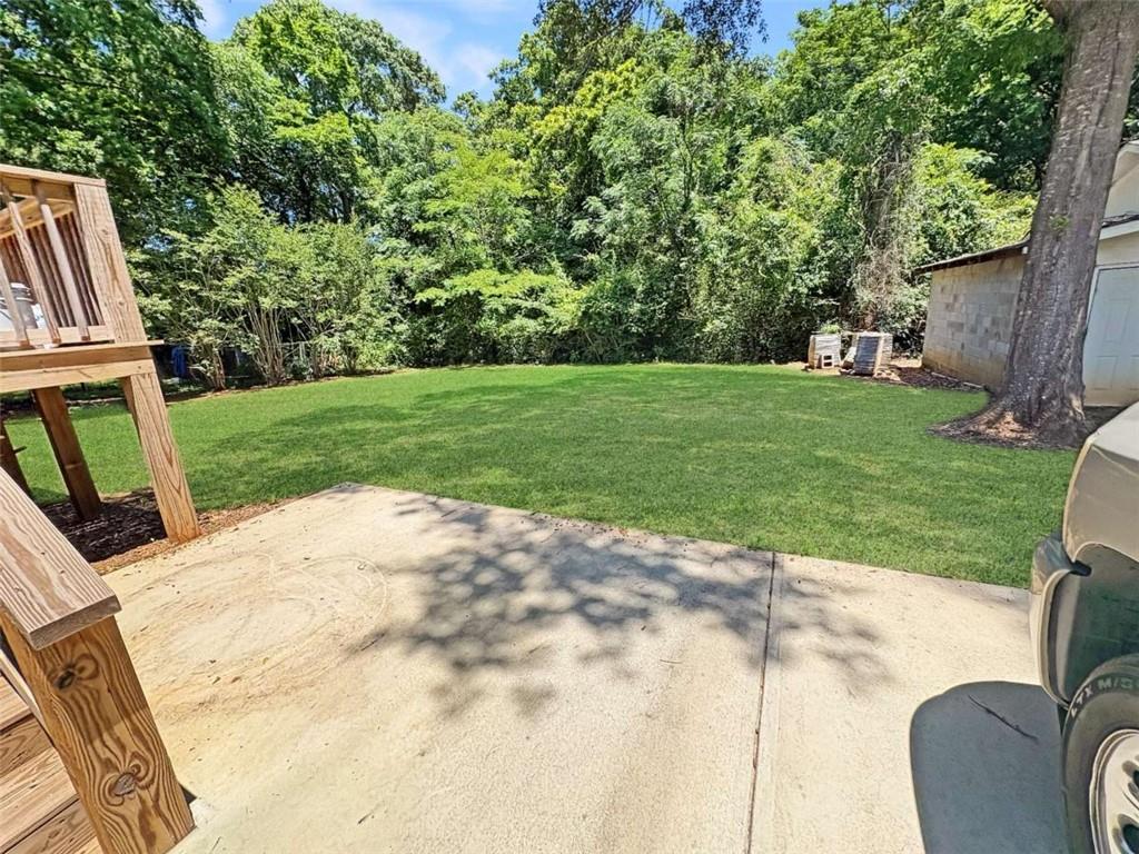 24 George Street Forsyth, GA 31029 - Photo 5 of 17 a view of backyard with outdoor seating