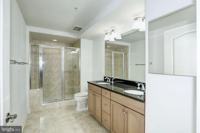 a view of a kitchen from a corridor