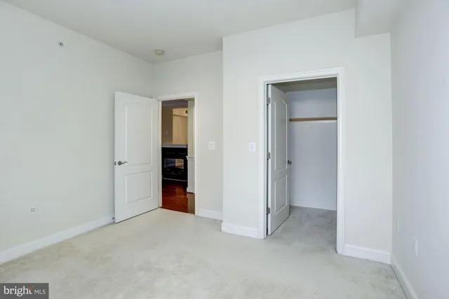 a bathroom with a sink a toilet and a large mirror