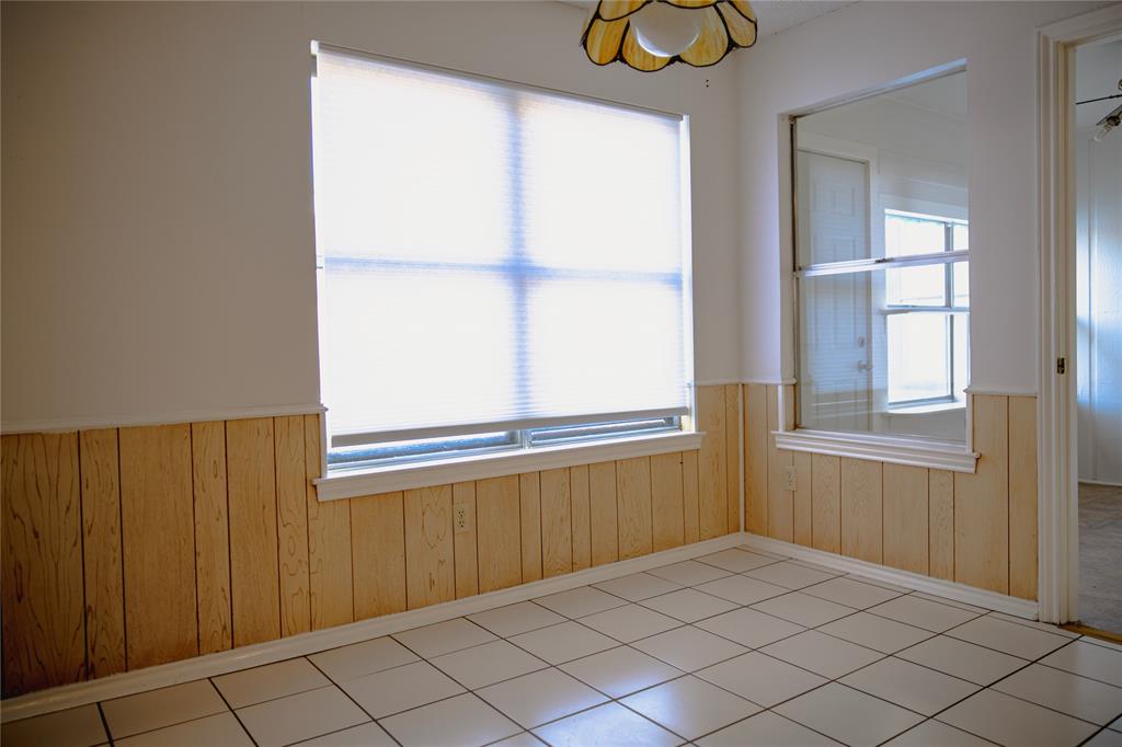 9029 Church Road Dallas, TX 75231 - Photo 16 of 40 a view of an empty room with window