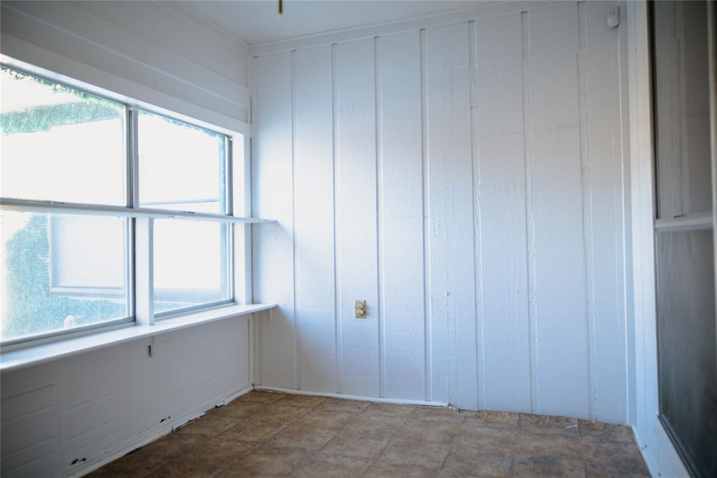 9029 Church Road Dallas, TX 75231 - Photo 21 of 40 a view of an empty room with a window