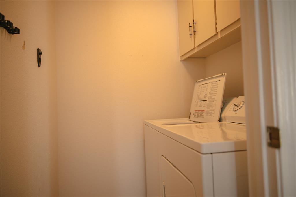9029 Church Road Dallas, TX 75231 - Photo 22 of 40 a utility room with dryer and washer