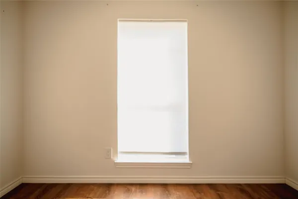 a view of a small space with wooden floor