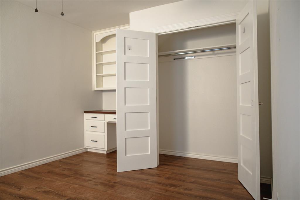 9029 Church Road Dallas, TX 75231 - Photo 31 of 40 a view of an empty room with wooden floor
