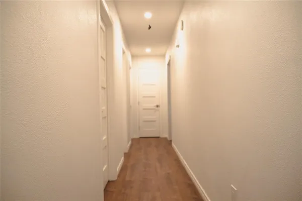 a view of a big room with closet and windows
