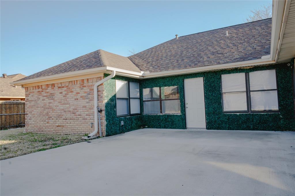9029 Church Road Dallas, TX 75231 - Photo 38 of 40 a front view of a house with a yard