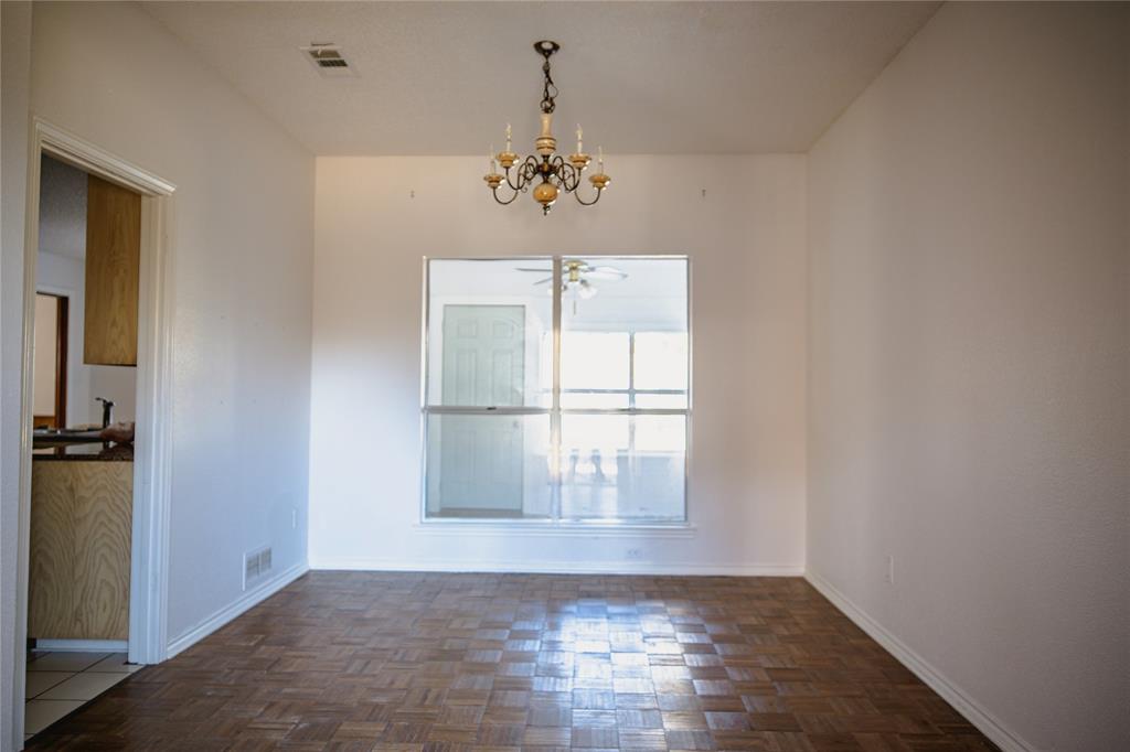 9029 Church Road Dallas, TX 75231 - Photo 5 of 40 a view of an empty room with a window
