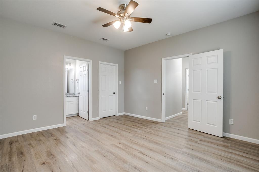 133 Winners Circle, Unit 302 Weatherford, TX 76087 - Photo 11 of 20 Unfurnished bedroom with light wood-style floors, ensuite bath, and ceiling fan