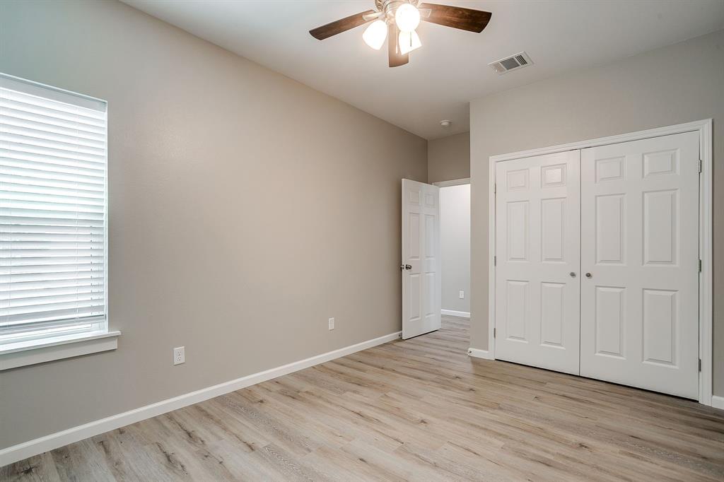 133 Winners Circle, Unit 302 Weatherford, TX 76087 - Photo 15 of 20 Unfurnished bedroom featuring light wood-type flooring, a closet, and ceiling fan
